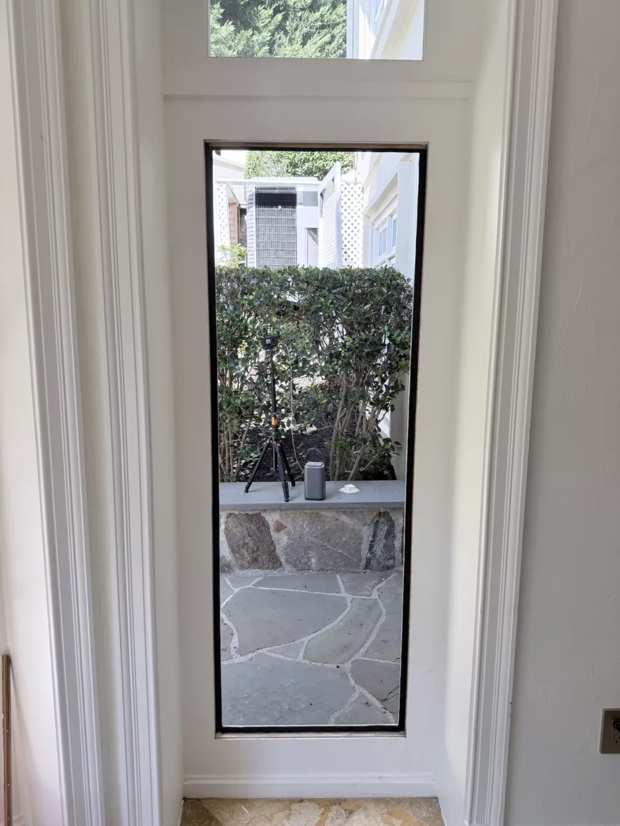 Window frame without glass and tools visible during replacement