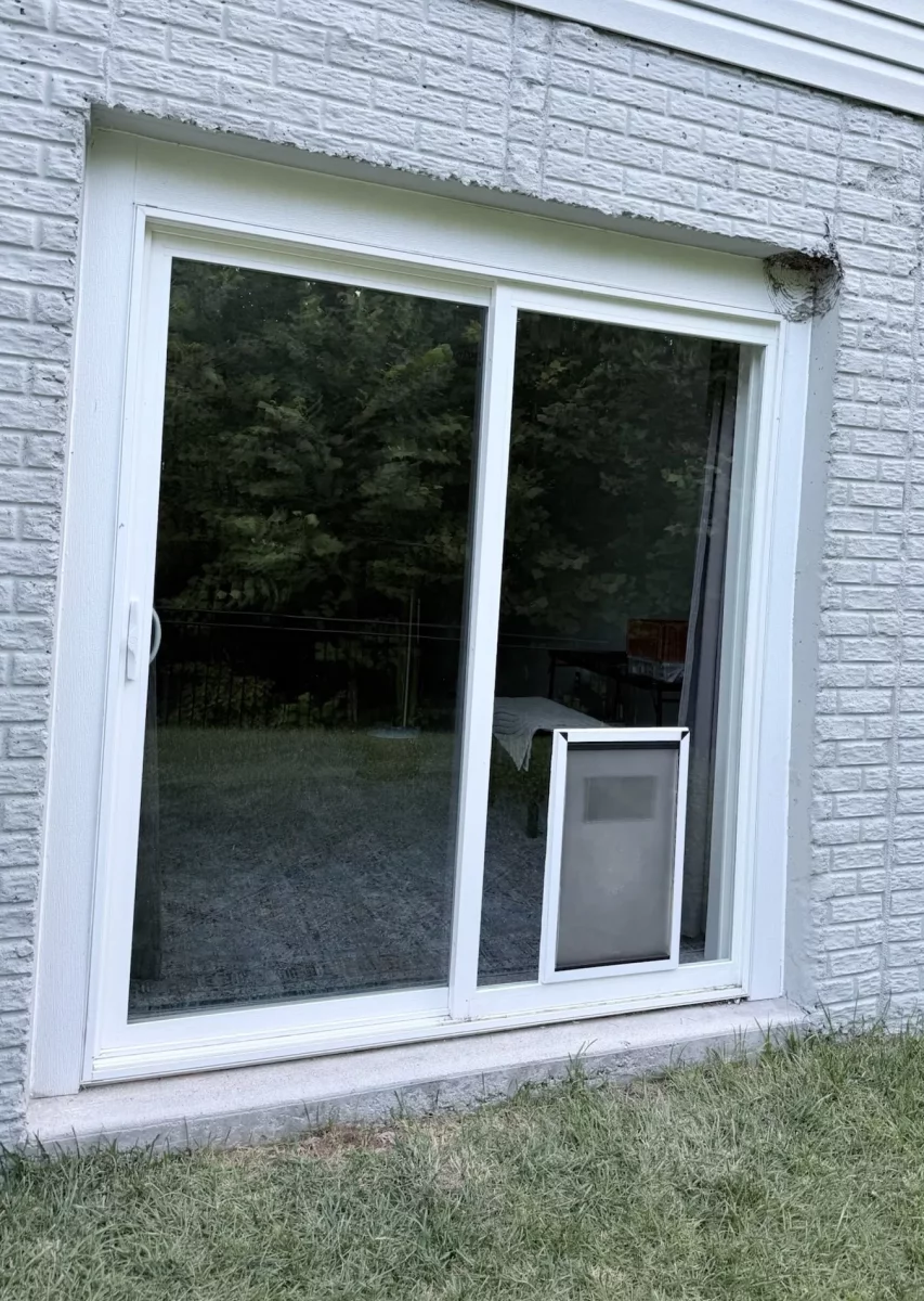 Exterior view of sliding patio door prepared for an extra-large pet door