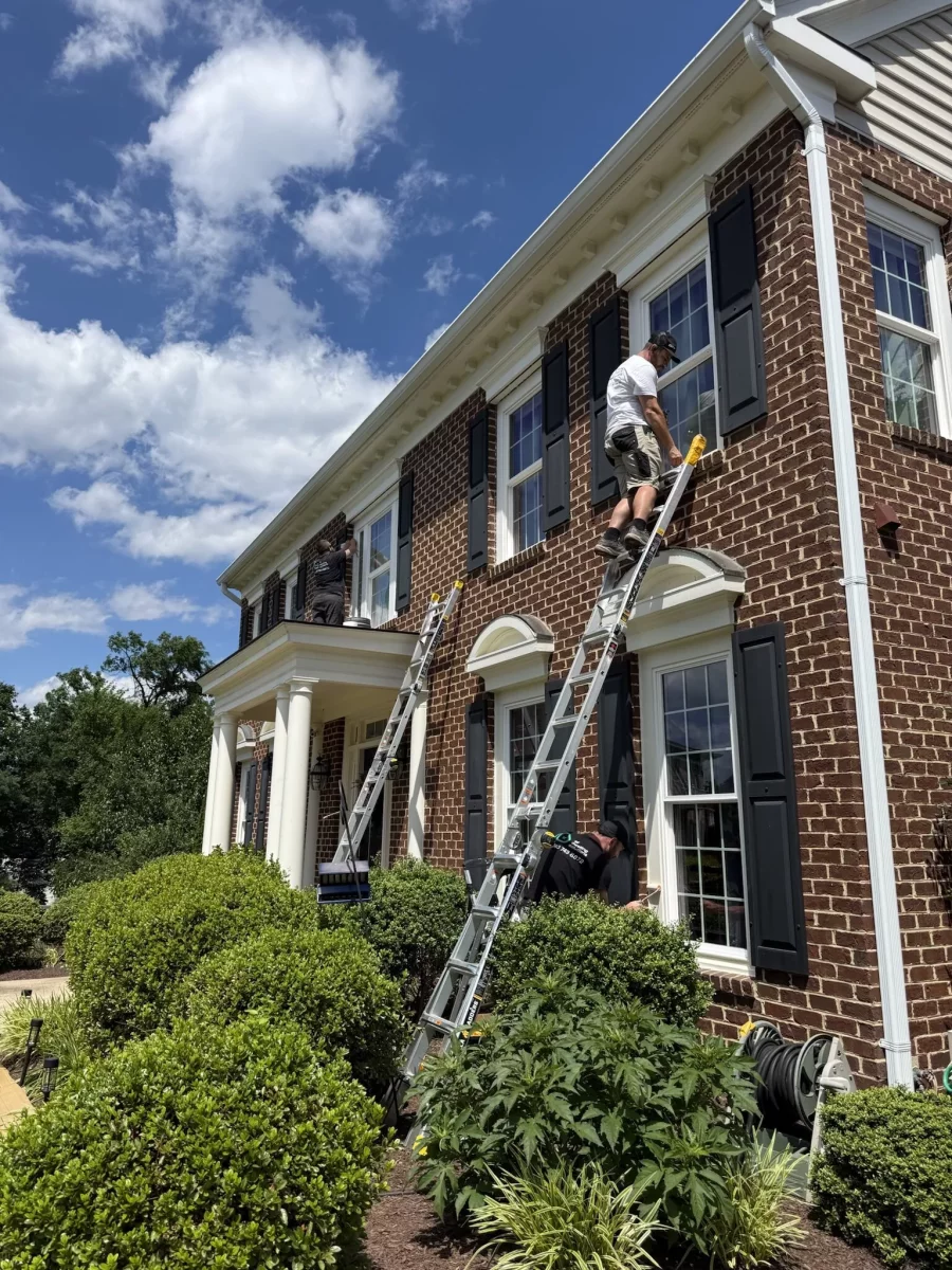 Professional full-frame window replacement on a brick home in Rockville, MD, completed by All Dwelling Solutions.