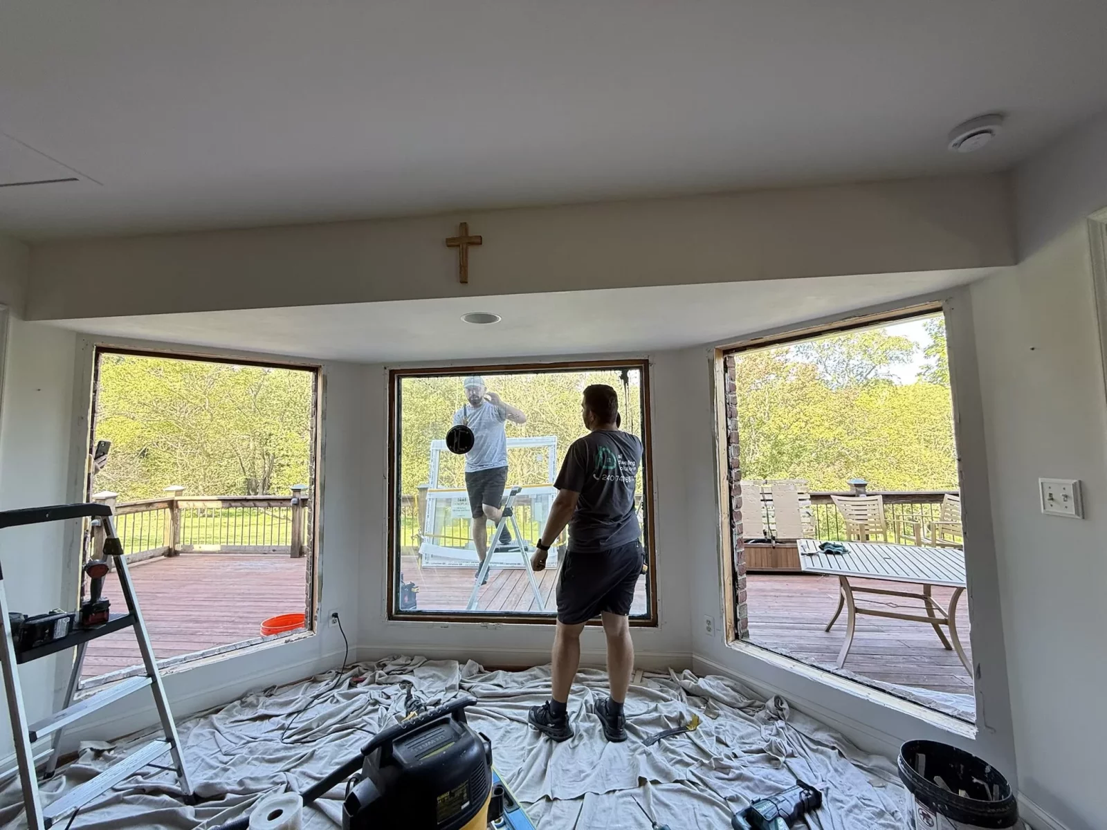 Full-frame Oknoplast window replacement in progress with multiple old windows removed in Monrovia, Maryland