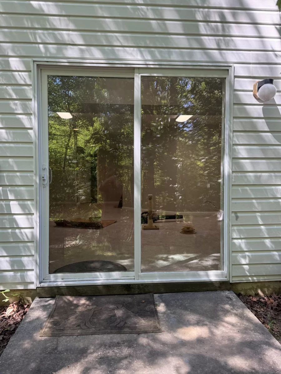 Completed sliding patio door glass replacement in Aspen Hill, MD, with new tempered glass installed in the existing door sash.