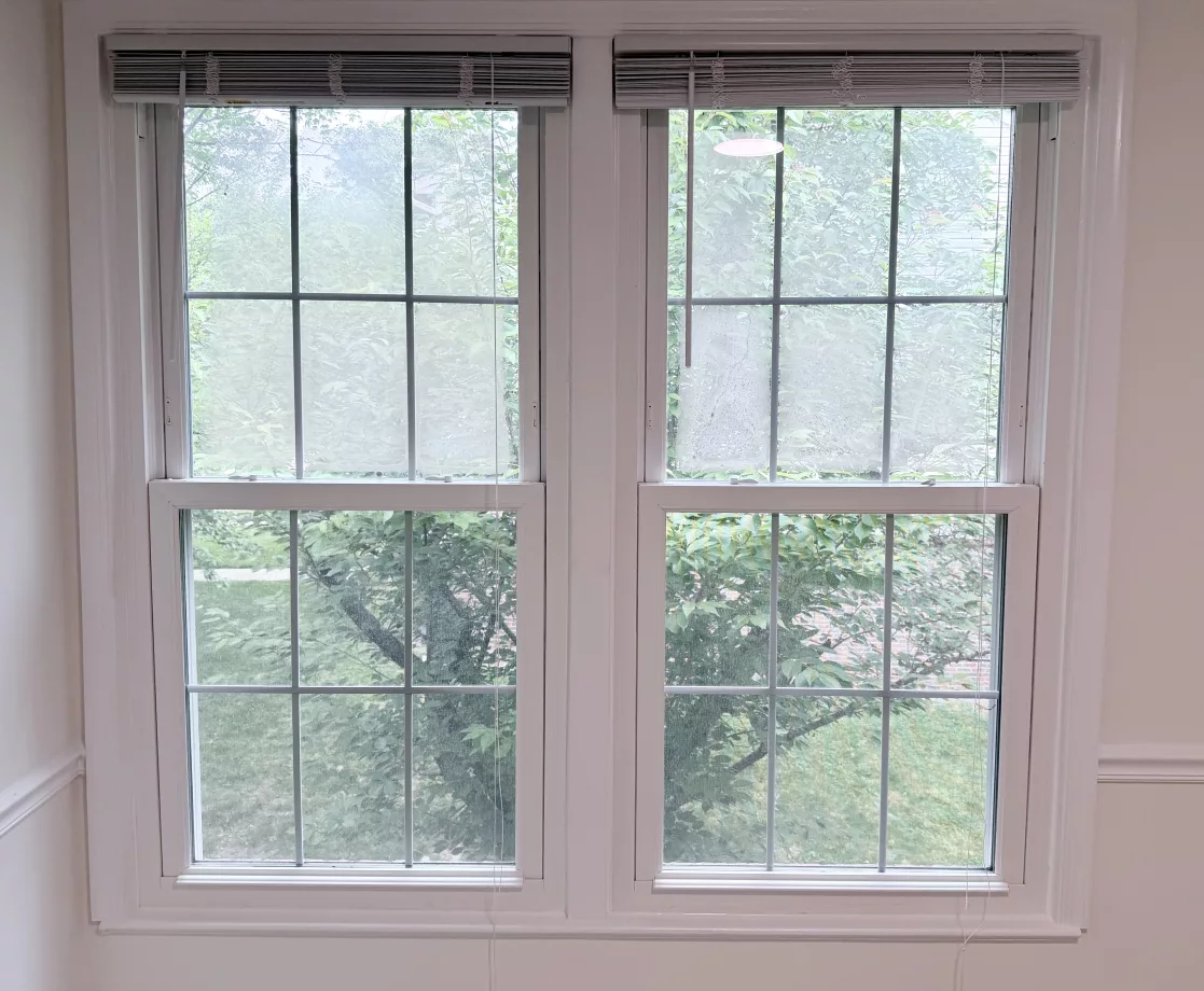 Foggy double-pane windows with failed seals and condensation trapped between the glass.