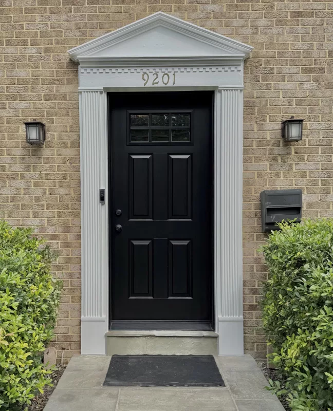 Luxury black front entry door professionally installed on a Bethesda home