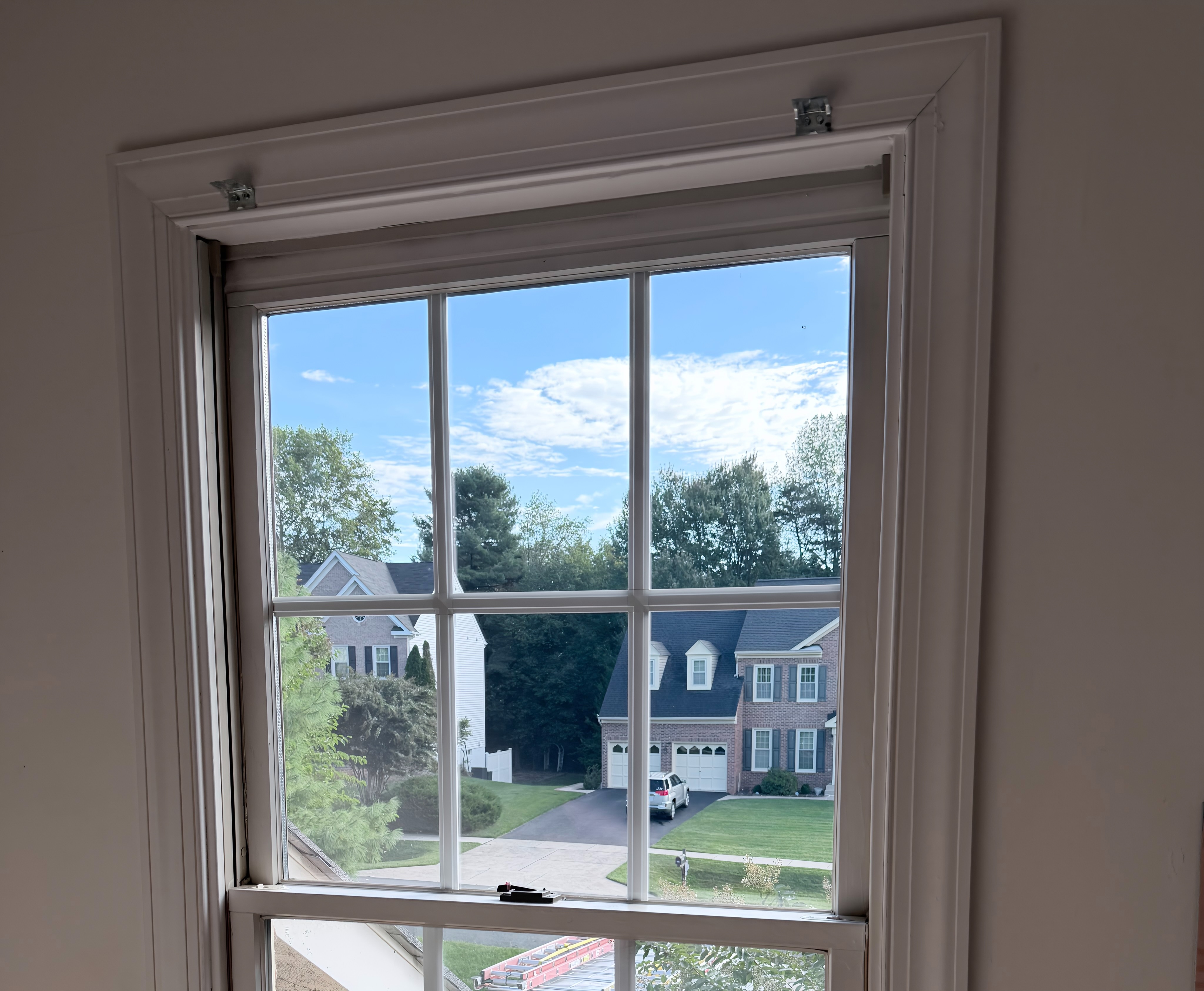 Newly installed energy-efficient window providing clear outdoor view and improved insulation.