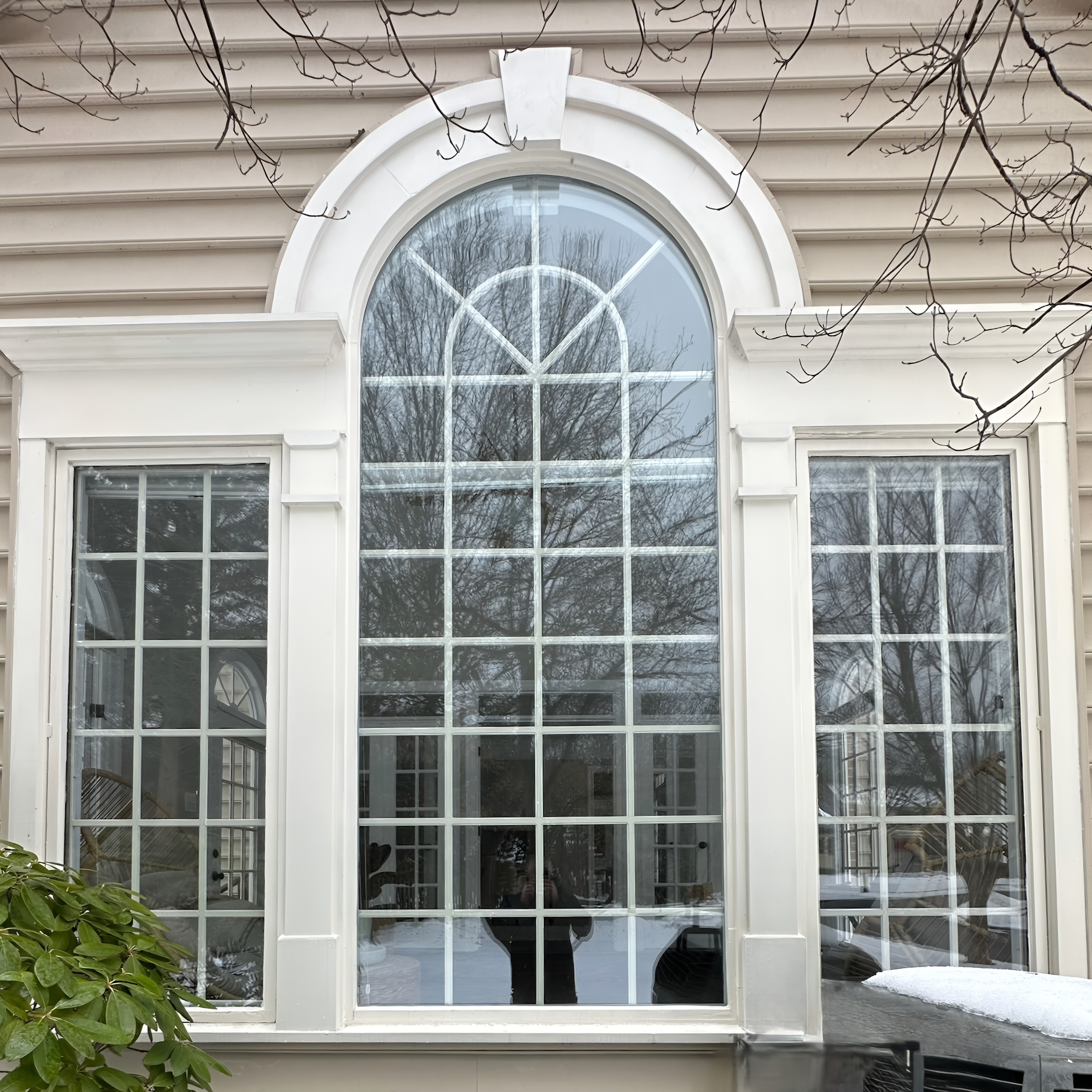Exterior after foggy glass replacement showing clear new panes and restored trim.