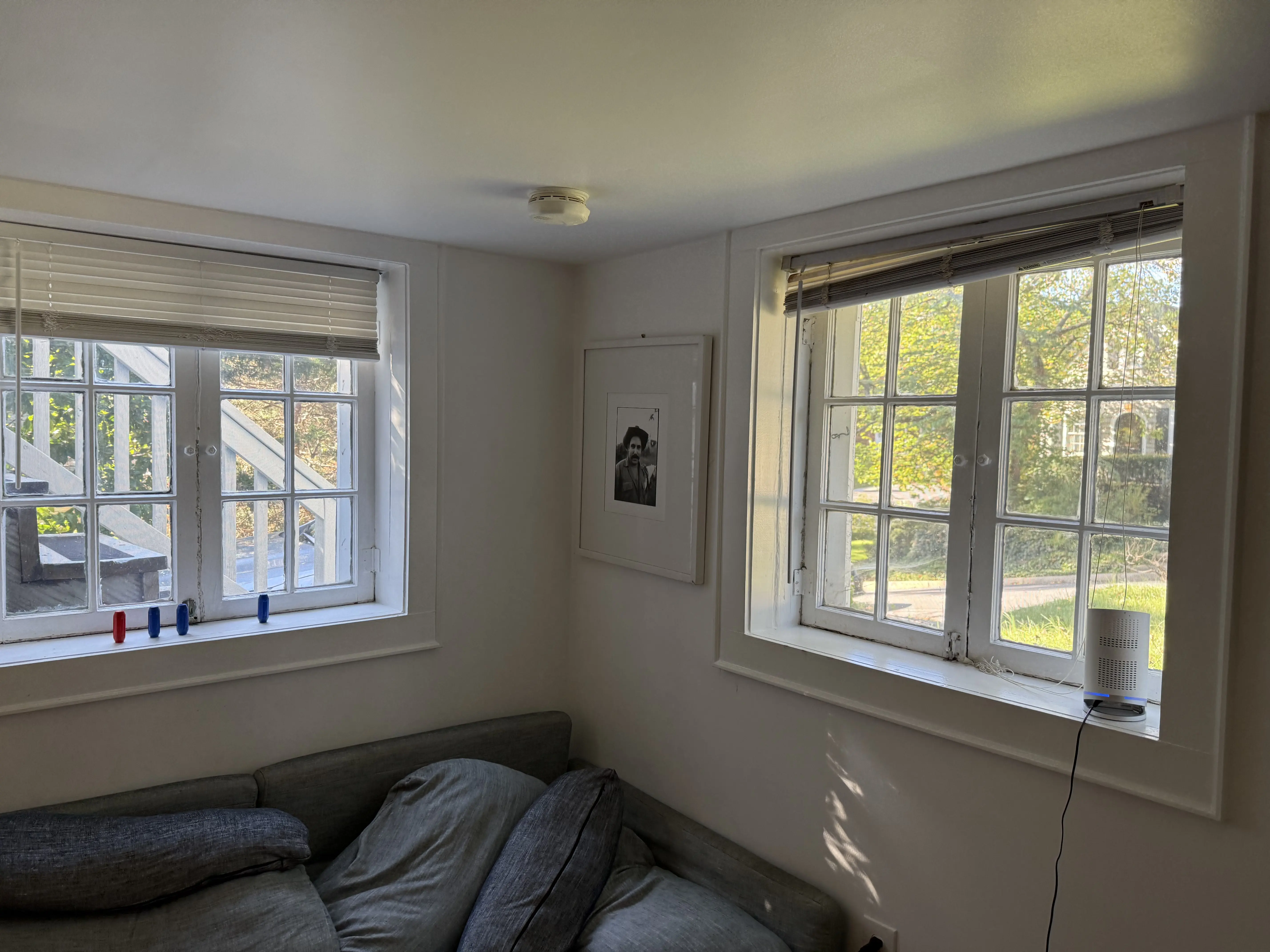 Old living room window before replacement showing outdated frame and poor insulation.