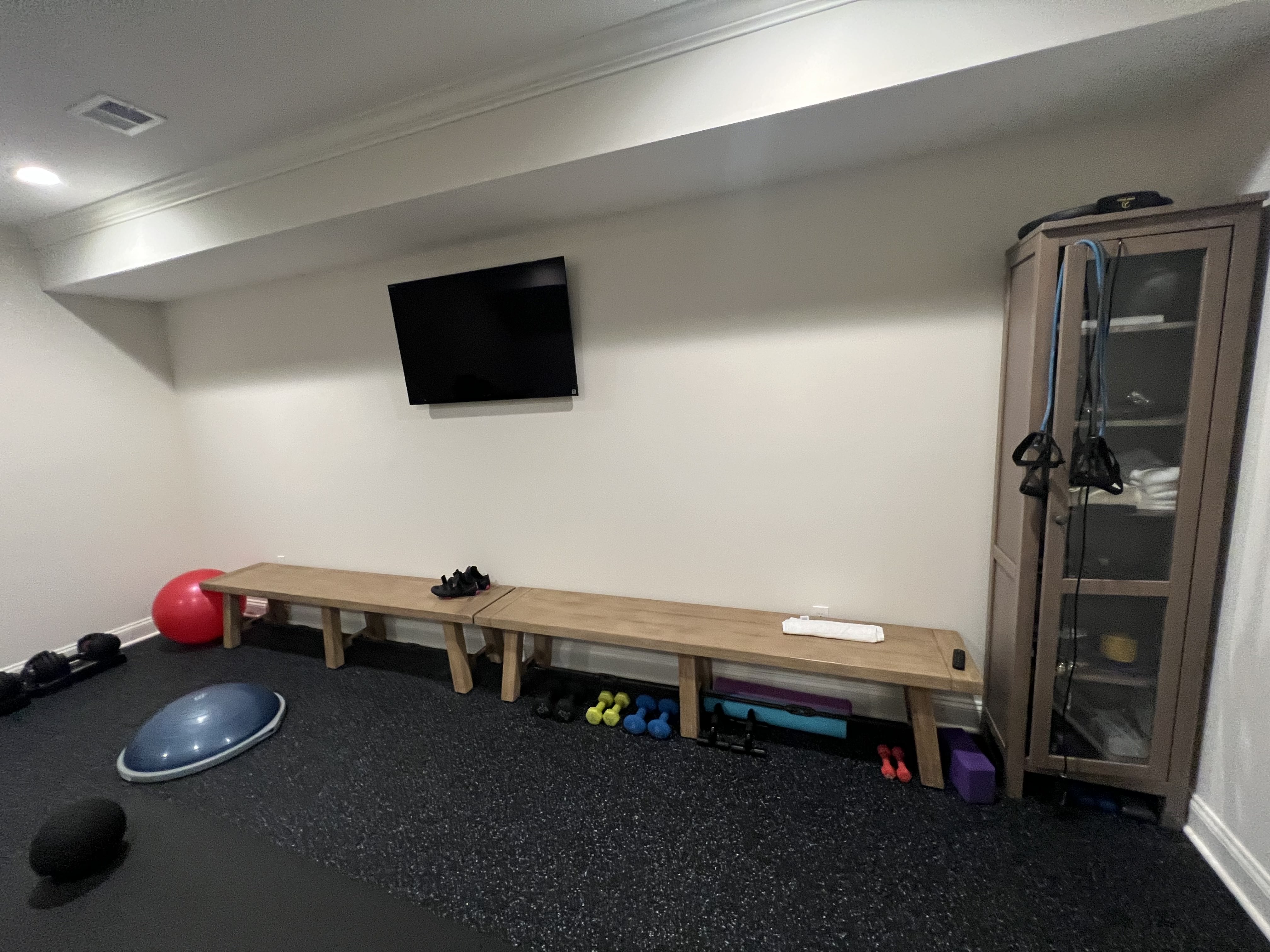 Custom wall-to-wall mirror installation in modern Bethesda home gym.
