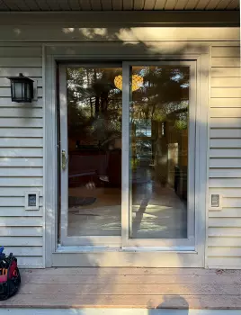 Patio Door Replacement and Wall Dog Door Installation project photo.