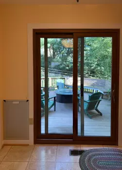 Patio Door Replacement and Wall Dog Door Installation project photo.
