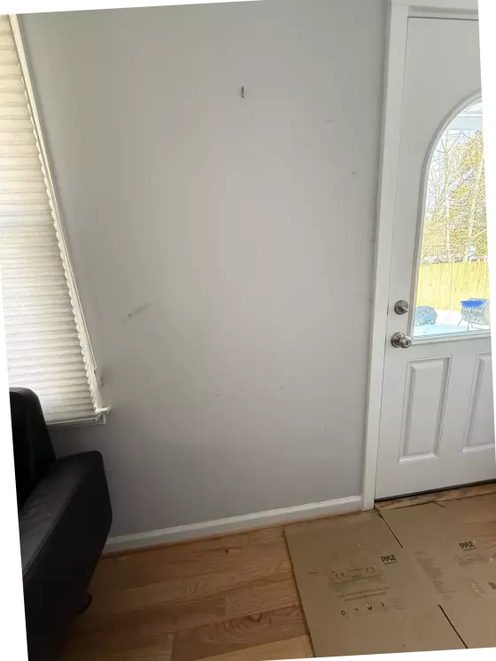 Interior wall and door with cardboard on the floor
