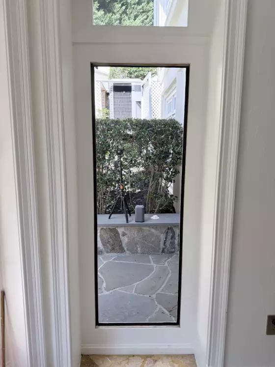 Window frame without glass and tools visible during replacement