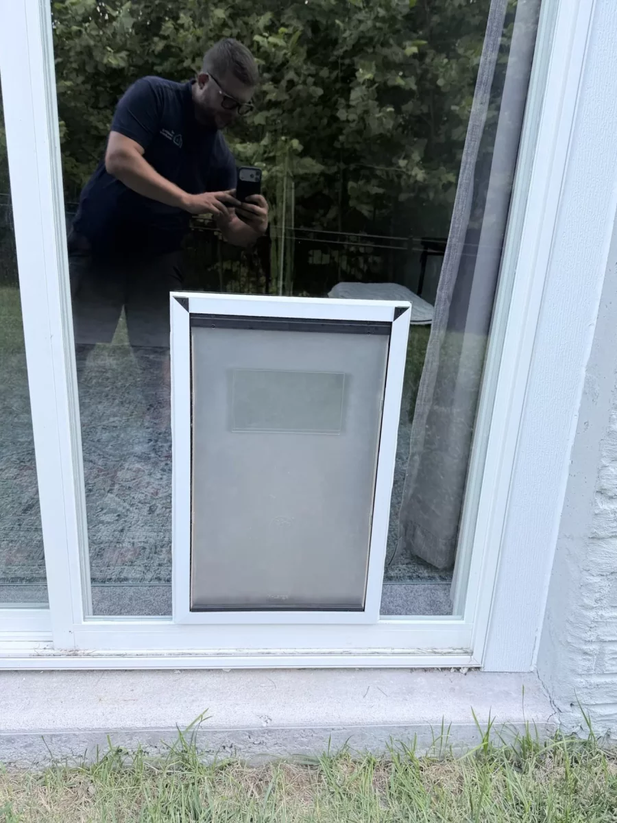 Professional installation of an extra-large dog door into sliding patio door glass