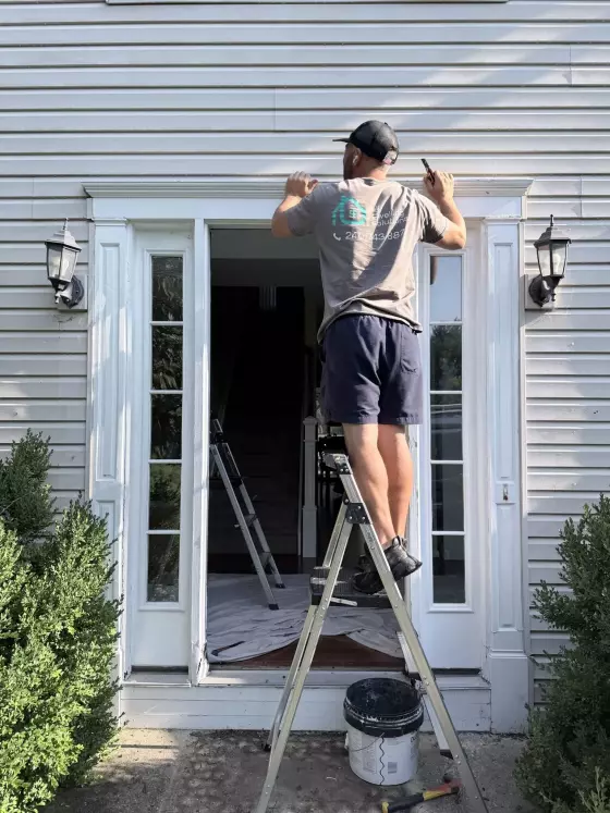 Professional front door replacement in progress