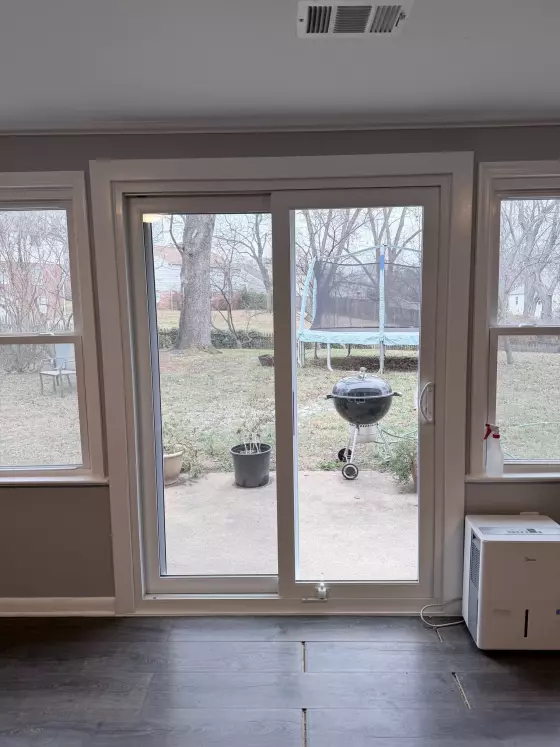 Sliding glass patio door installed in a residential interior room