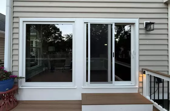 White replacement picture and sliding patio door windows professionally installed on a home in Rockville, MD.