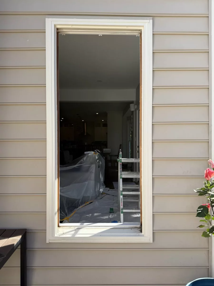 Window replacement in progress in Rockville, MD, showing the existing window removed and opening prepared for installation.