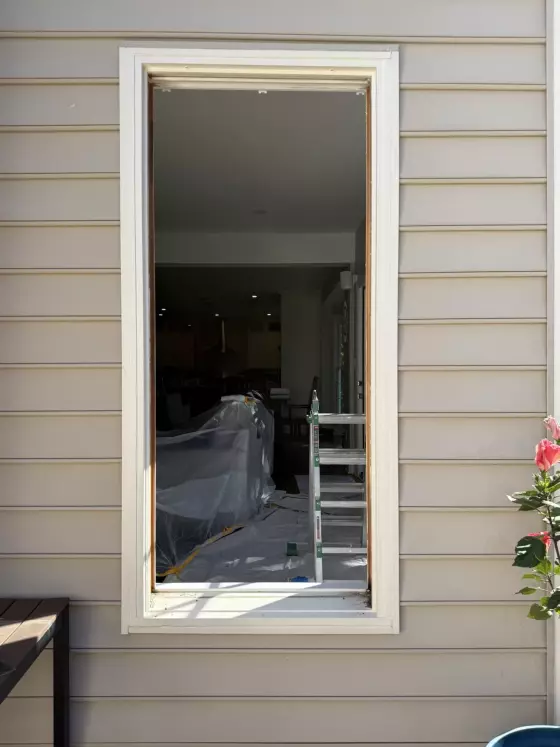 Window replacement in progress in Rockville, MD, showing the existing window removed and opening prepared for installation.