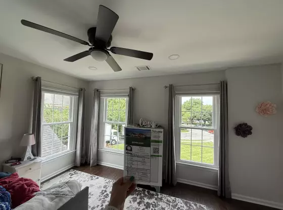 Energy-efficient double-hung window replacement in Rockville, MD, with grids and professional full-frame installation.