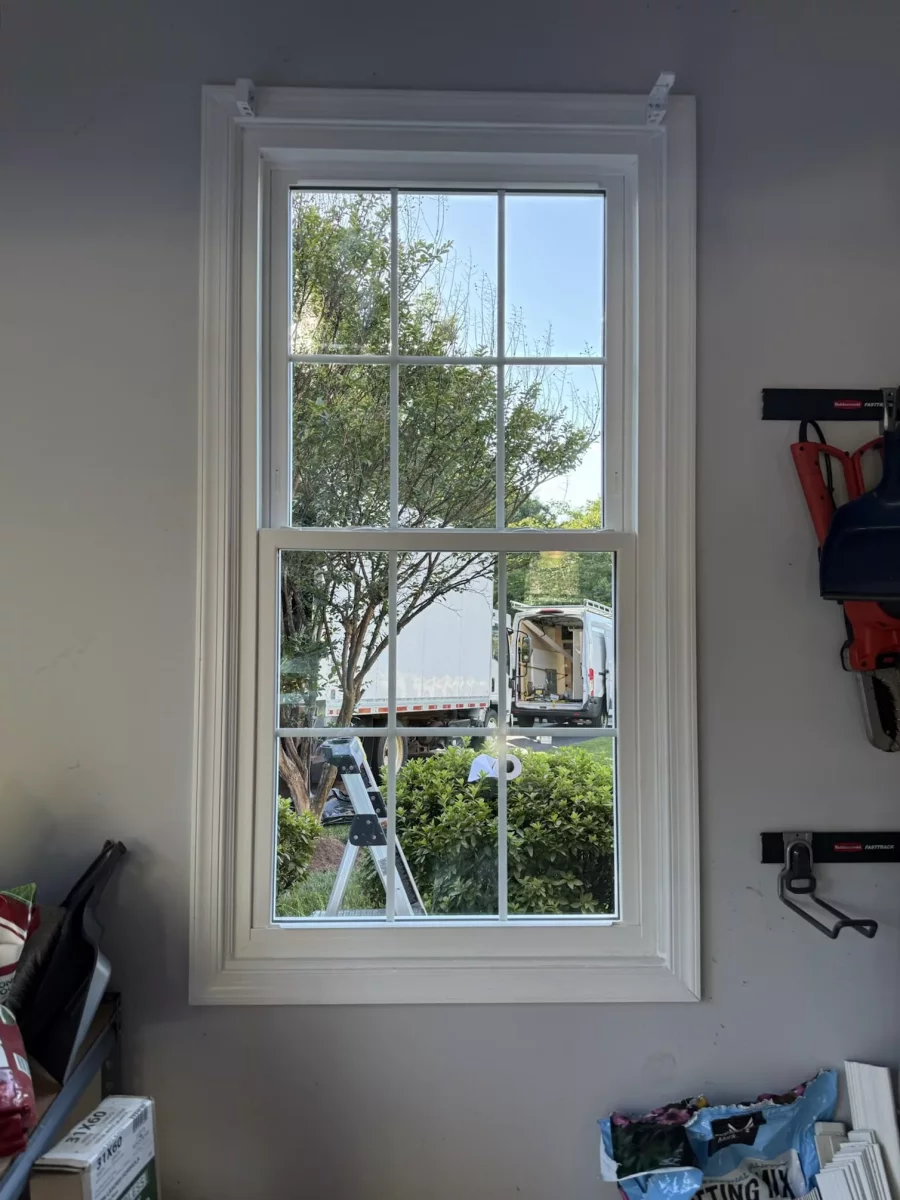 Energy-efficient double-hung window replacement in Rockville, MD, with grids and professionally finished interior trim