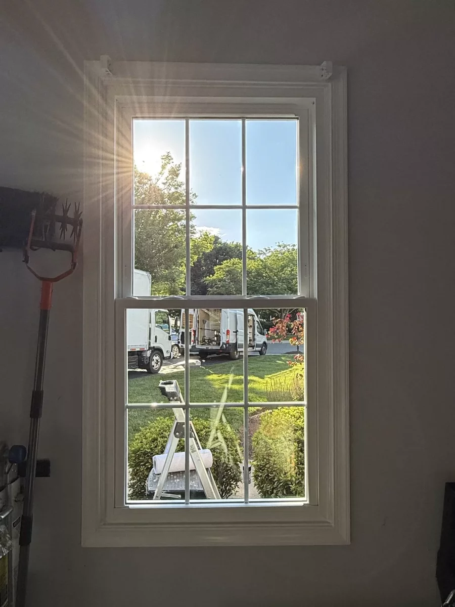 Energy-efficient double-hung window replacement in Rockville, MD, with grids and professionally finished interior trim