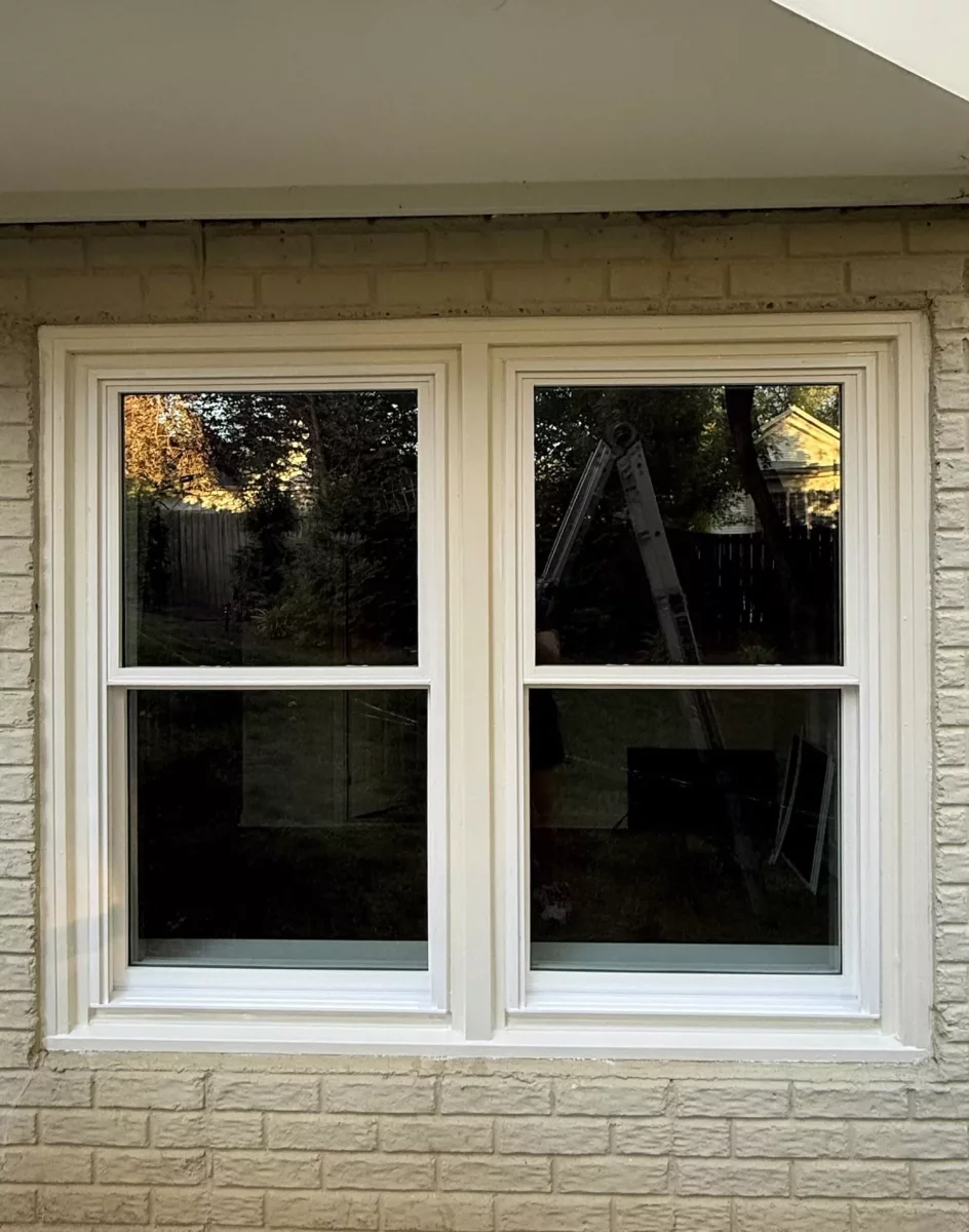 Completed full-frame double-hung window replacement with clean white exterior trim in Rockville, MD.