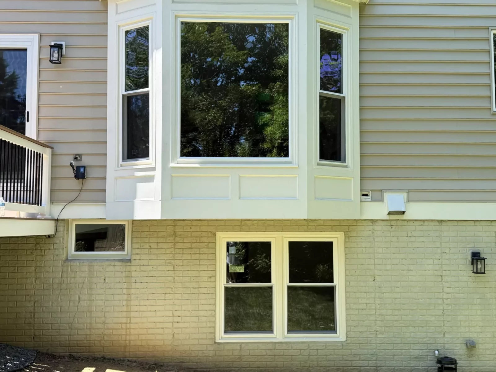 Exterior view of house with new bay window and siding