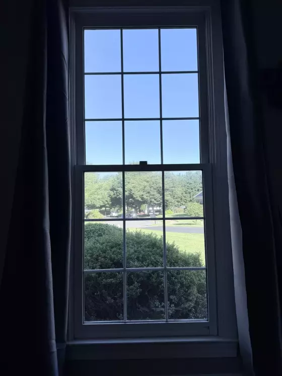 Double-hung window with grid pattern viewed from inside