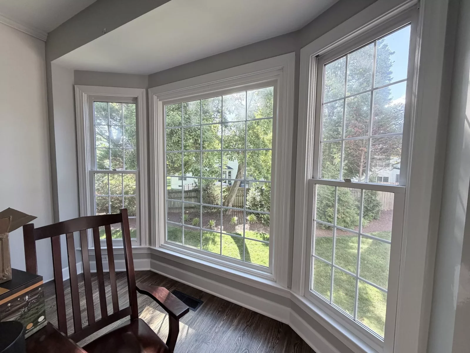 Large bay window with white trim in a residential interior