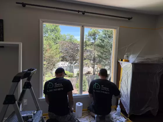 Professional window replacement in progress in Rockville, MD, showing installers completing an energy-efficient window installation.