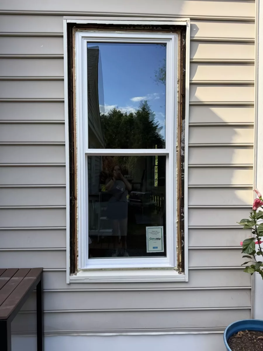 New energy-efficient double-hung window installation in Rockville, MD, shown before exterior trim and sealing are completed.