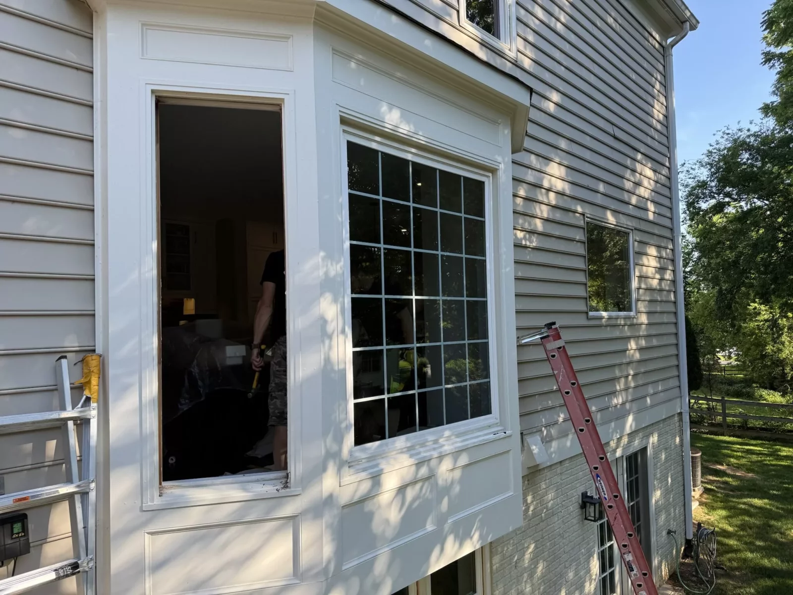 Full-frame bay window replacement in Rockville, MD, showing professional installation of new energy-efficient windows with exterior trim.