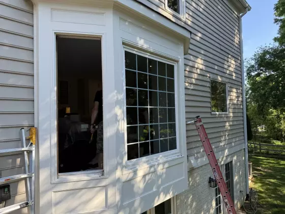 Full-frame bay window replacement in Rockville, MD, showing professional installation of new energy-efficient windows with exterior trim.