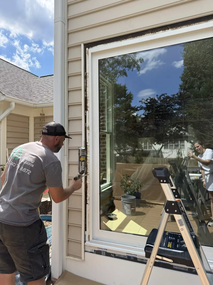 Professional full-frame picture window installation in Rockville, MD, with weatherproof sealing and exterior finishing.