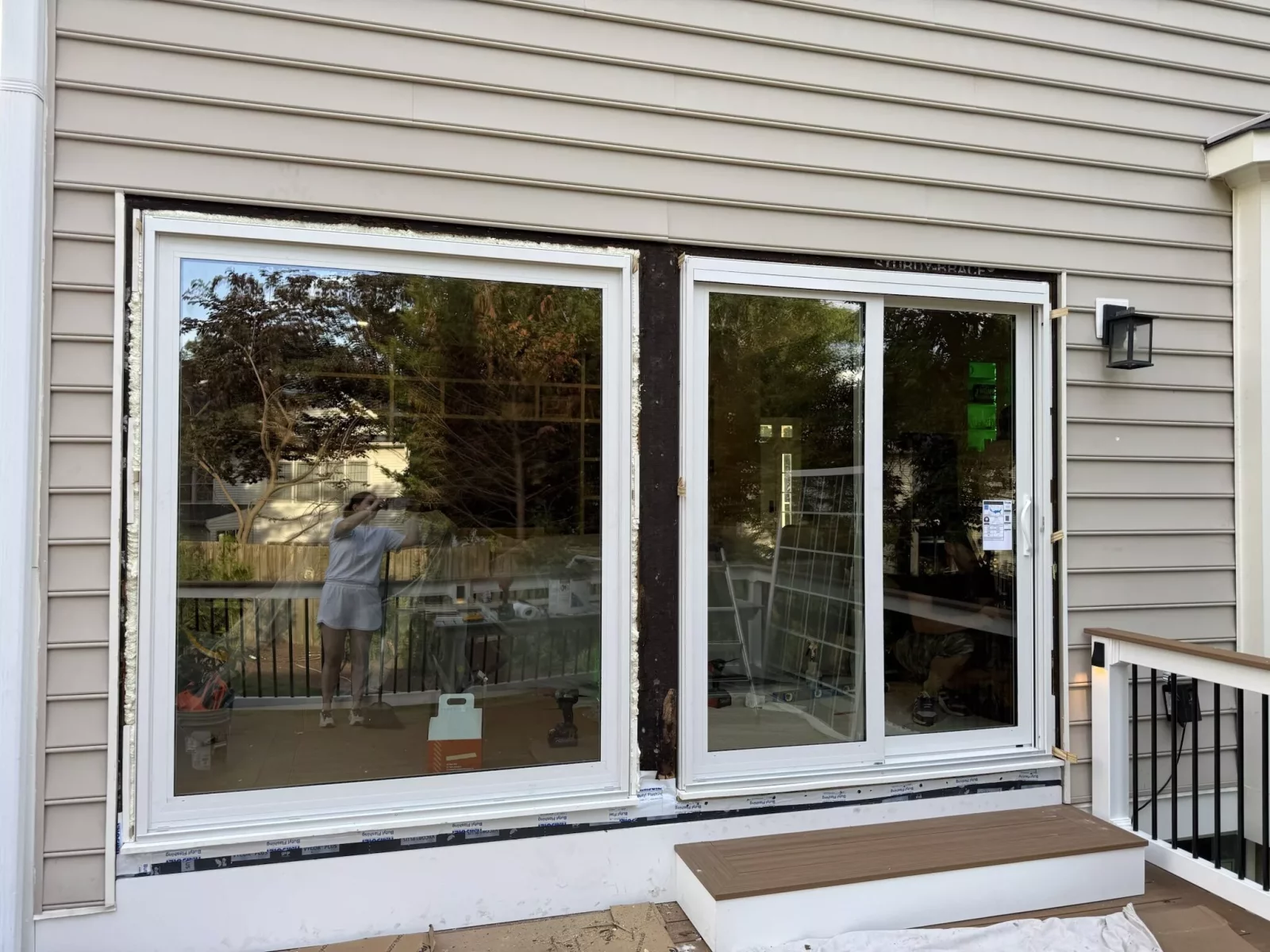 Full-frame patio door replacement in Rockville, MD, showing new energy-efficient units during professional installation.