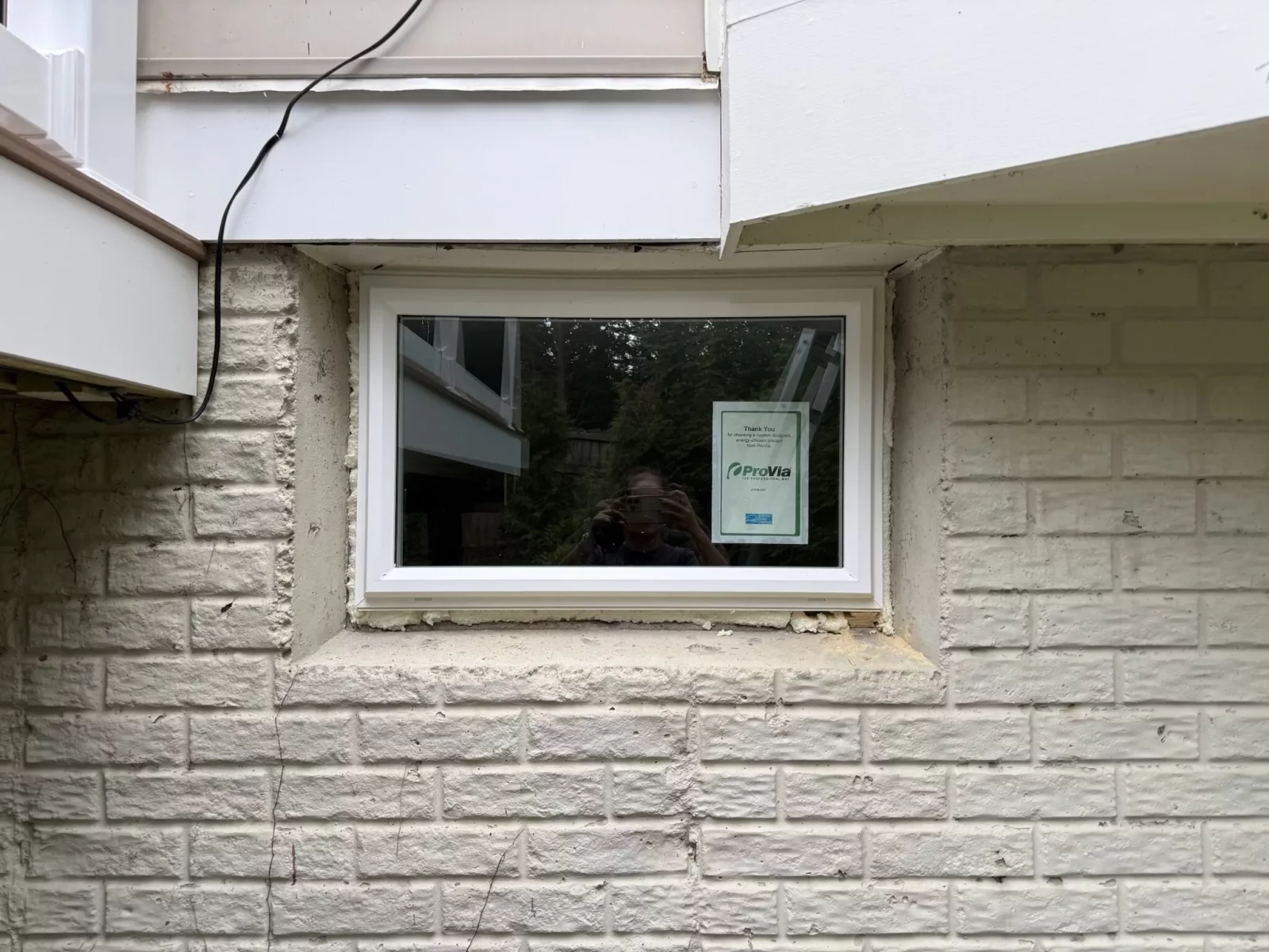 Energy-efficient basement window replacement with a new custom-fit vinyl wind