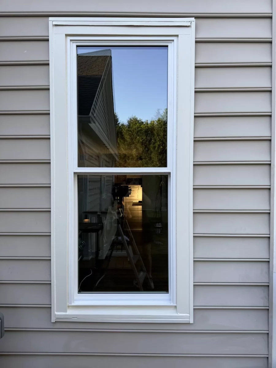 Energy-efficient double-hung window replacement with clean white exterior trim in Rockville, MD.