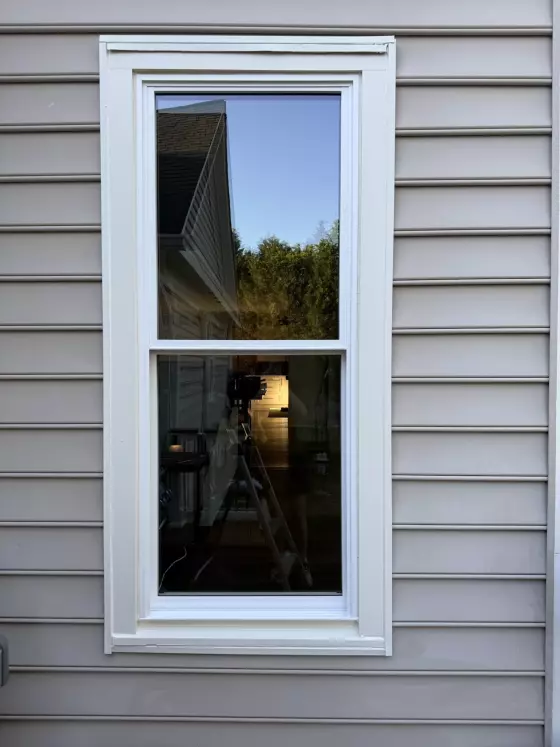 Energy-efficient double-hung window replacement with clean white exterior trim in Rockville, MD.