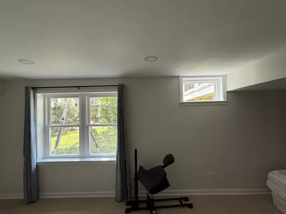 New double-hung windows and basement picture window professionally installed in Rockville, MD.