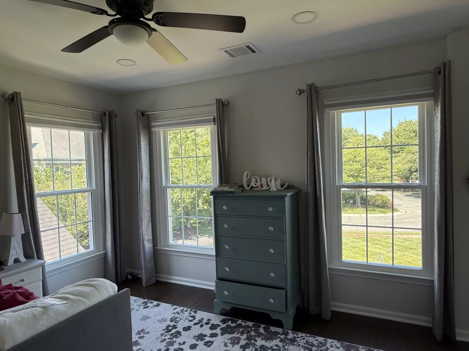Energy-efficient double-hung window replacement in Rockville, MD, with grids and professionally finished interior trim.