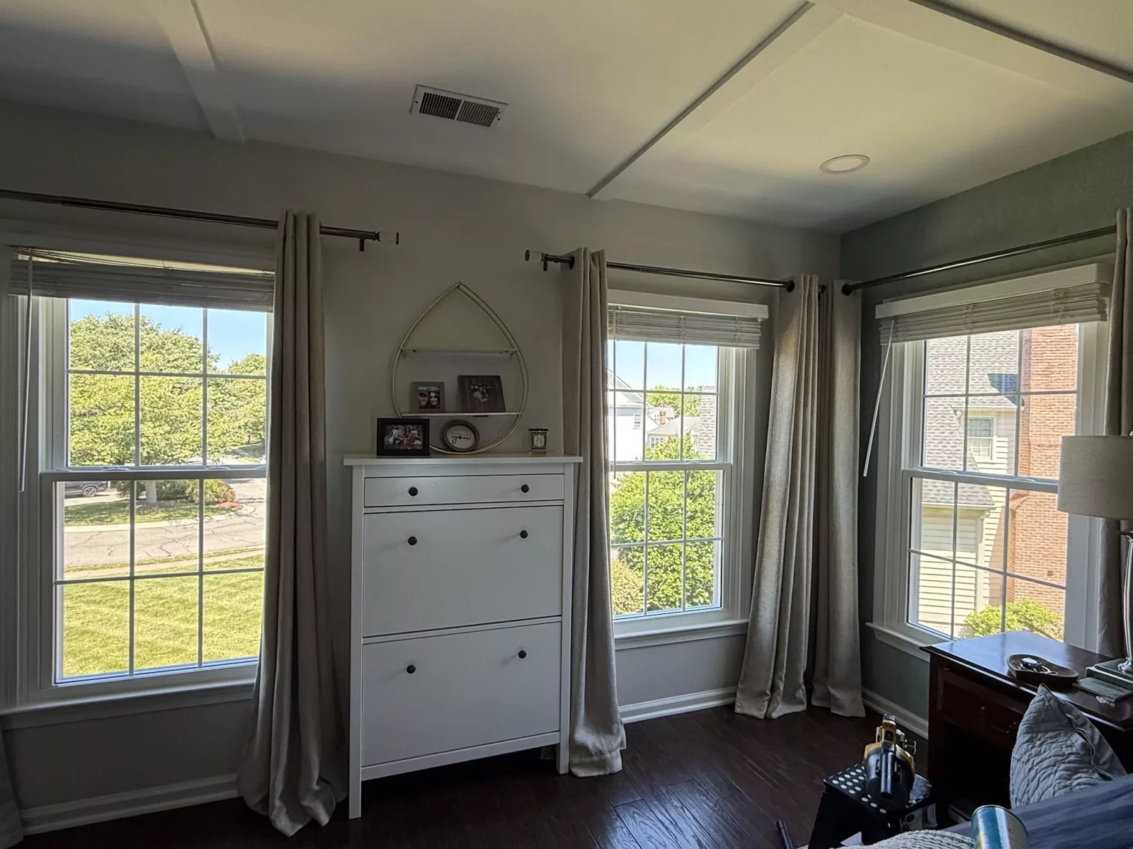 Energy-efficient double-hung window replacement in Rockville, MD, with grids and professionally finished interior trim.