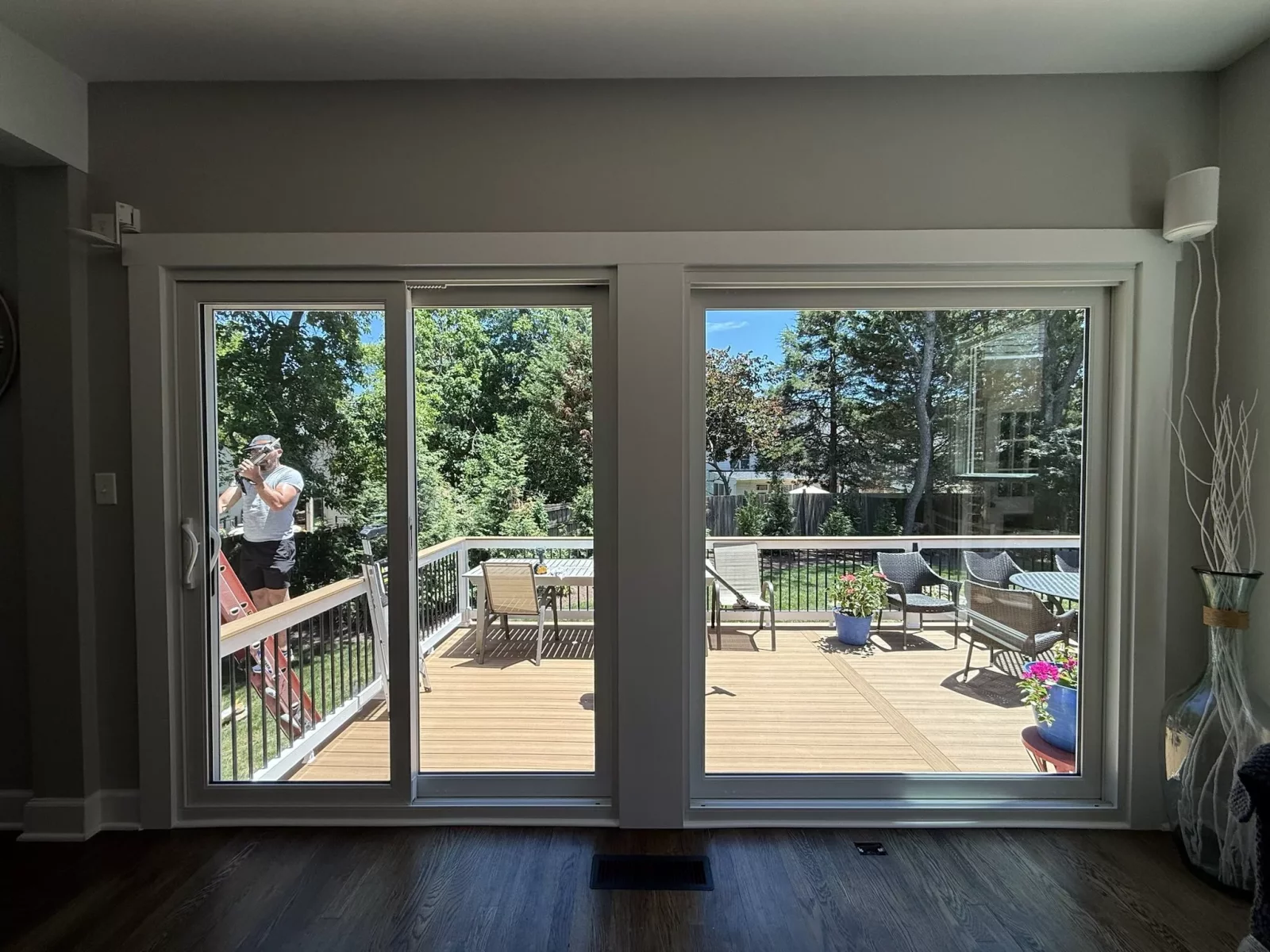 Completed patio door and large picture window replacement with clean interior trim in Rockville, MD.