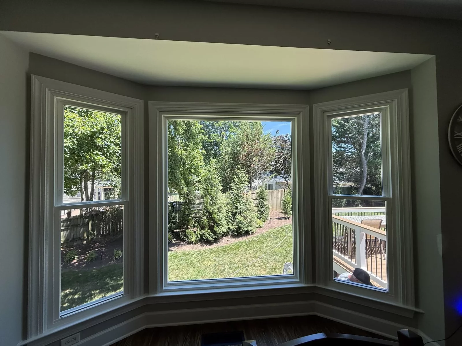 Completed bay window replacement with new double-hung side windows and a large picture window in Rockville, MD.