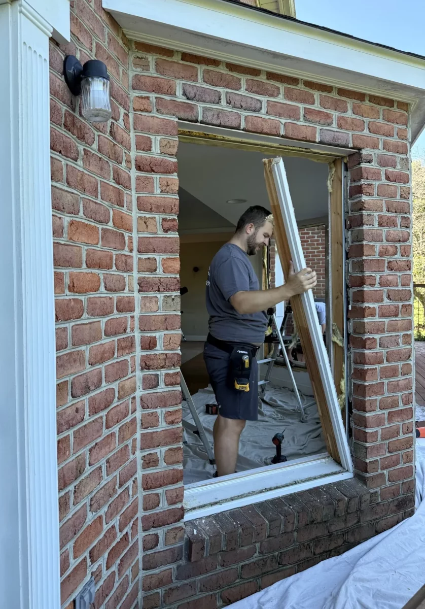 Full-frame window replacement in progress with old window frame removal for Oknoplast installation in Monrovia, Maryland