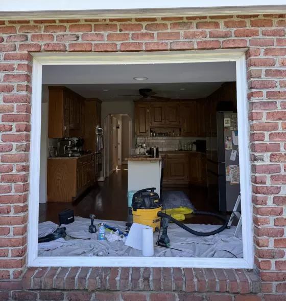 Full-frame window replacement showing the opening prepared for new Oknoplast tilt-and-turn window installation in Monrovia, MD