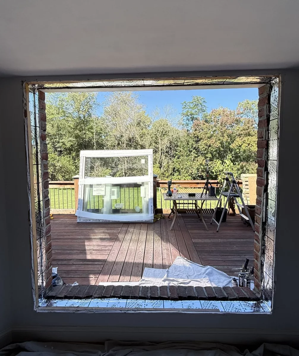 Preparing window opening and sill  with high-quality flash tape for full-frame Oknoplast tilt-and-turn window installation in Monrovia, Maryland