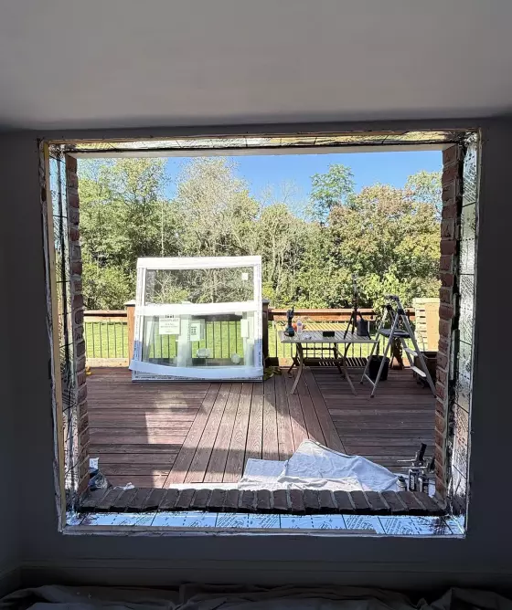 Preparing window opening and sill  with high-quality flash tape for full-frame Oknoplast tilt-and-turn window installation in Monrovia, Maryland