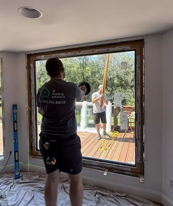 Professional Oknoplast tilt-and-turn window installation in progress during full-frame replacement in Monrovia, Maryland