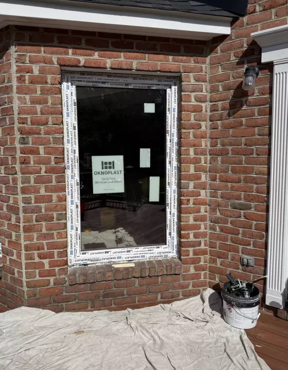 Oknoplast tilt-and-turn window installation showing professional frame leveling and securing in Monrovia, Maryland