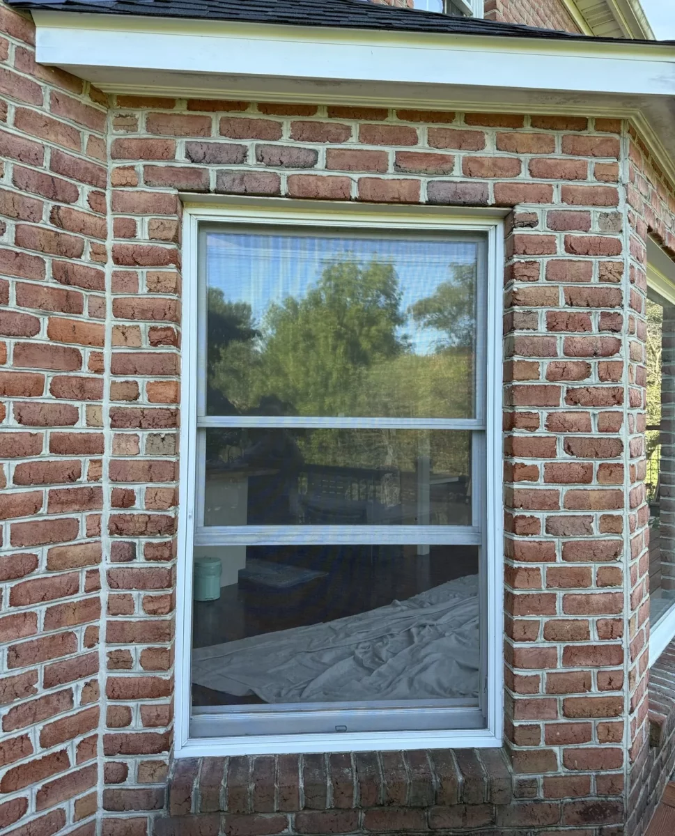 Before Oknoplast tilt-and-turn window replacement at a brick home in Monrovia, Maryland