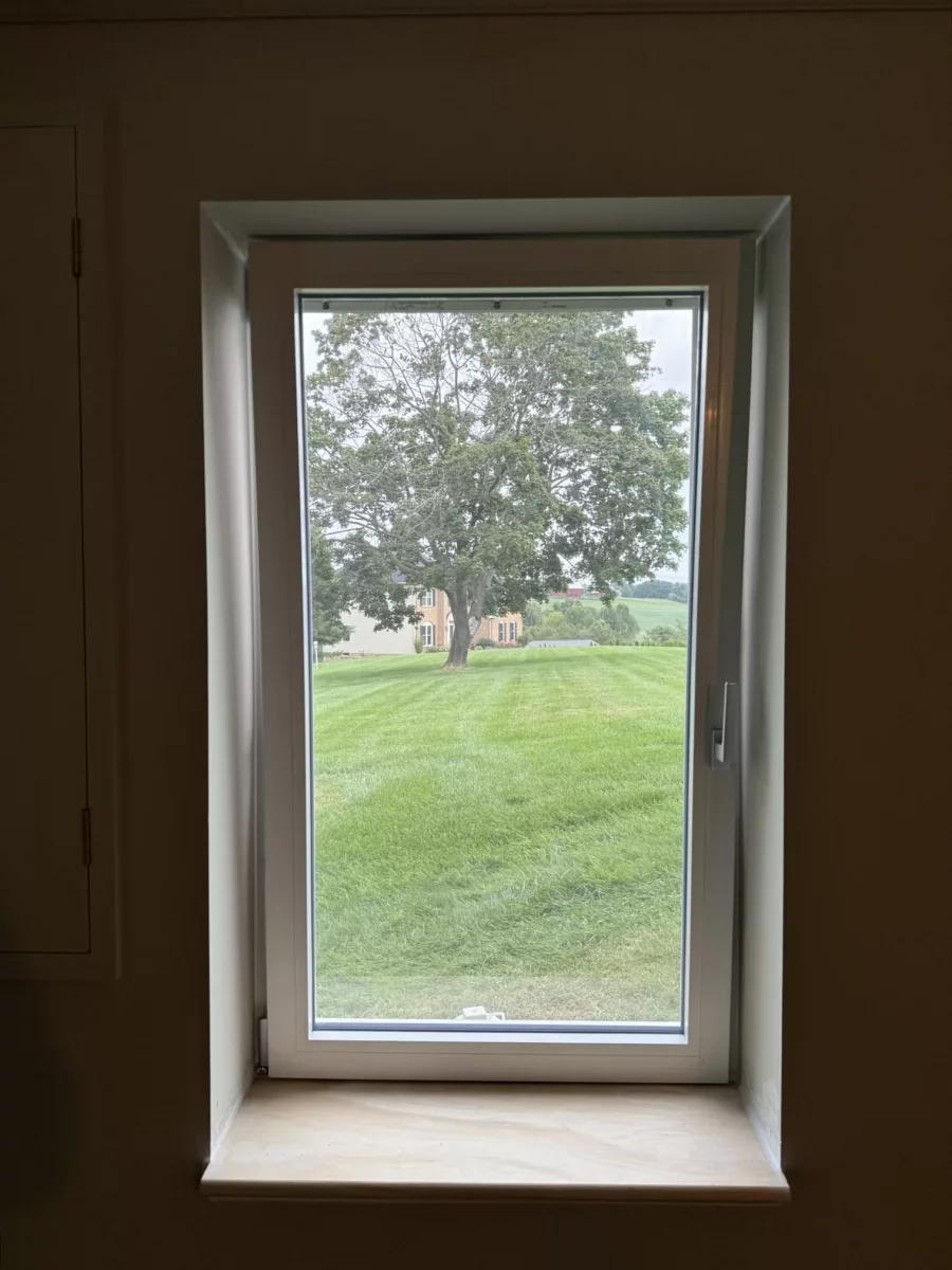 Single window with white frame and sill viewed from inside